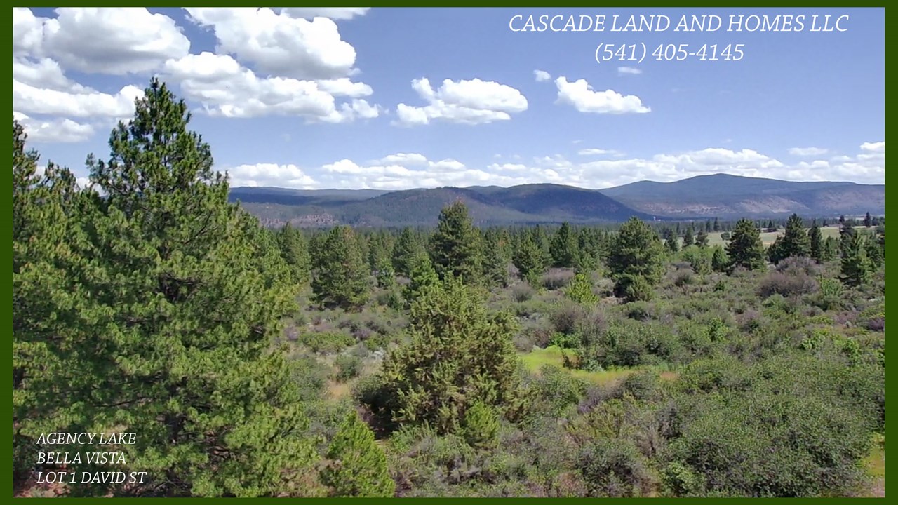drone photo from the property showing just some of the spectacular territorial views of the mountains surrounding this gorgeous property. it isn't just agency lake that you have views from here, you also have views of the valley and pastureland, volcanic bluffs and the rolling hills that lead to the lake!