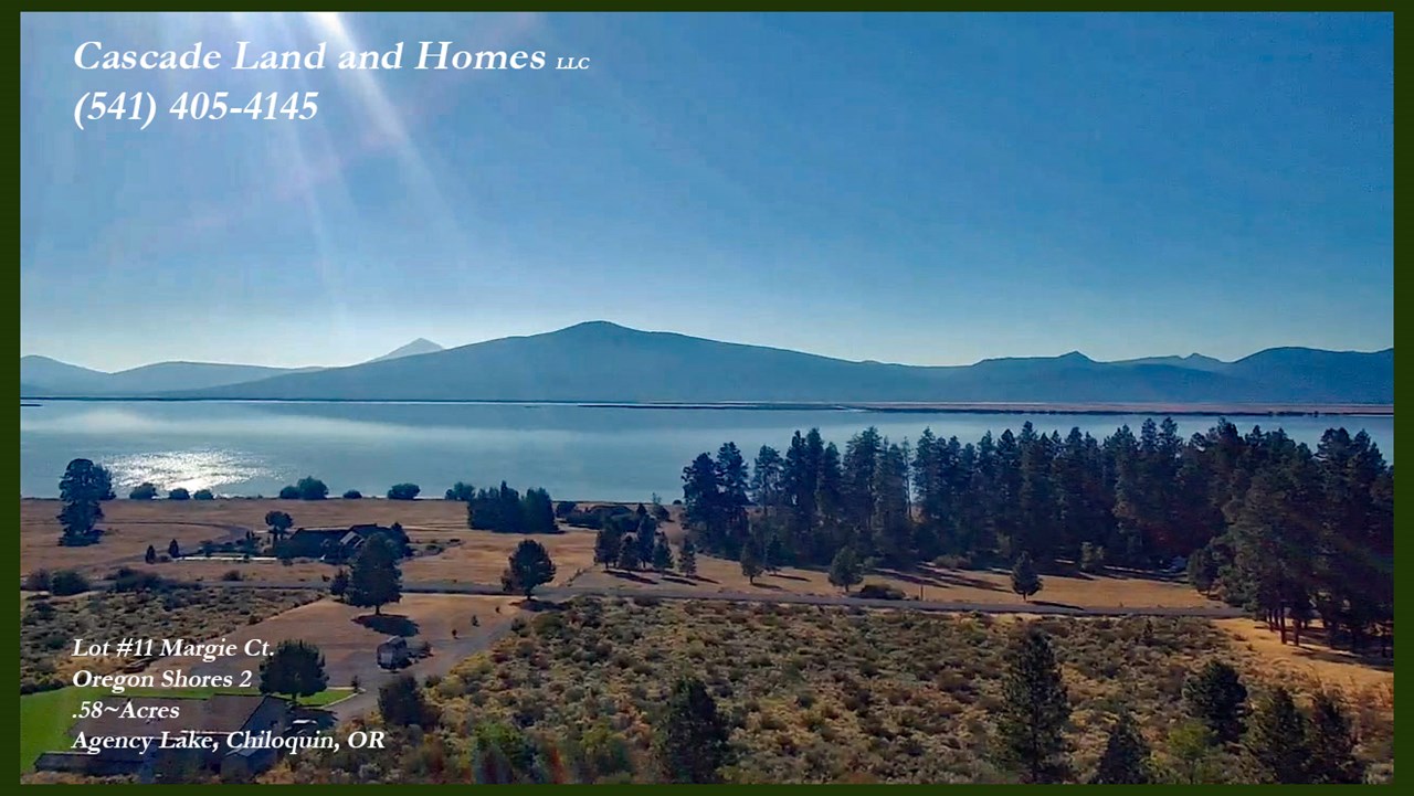 this is a drone photo from above the property. there are panoramic views of agency lake and the cascade mountains. this is one of the most desirable view-lots in the subdivision!