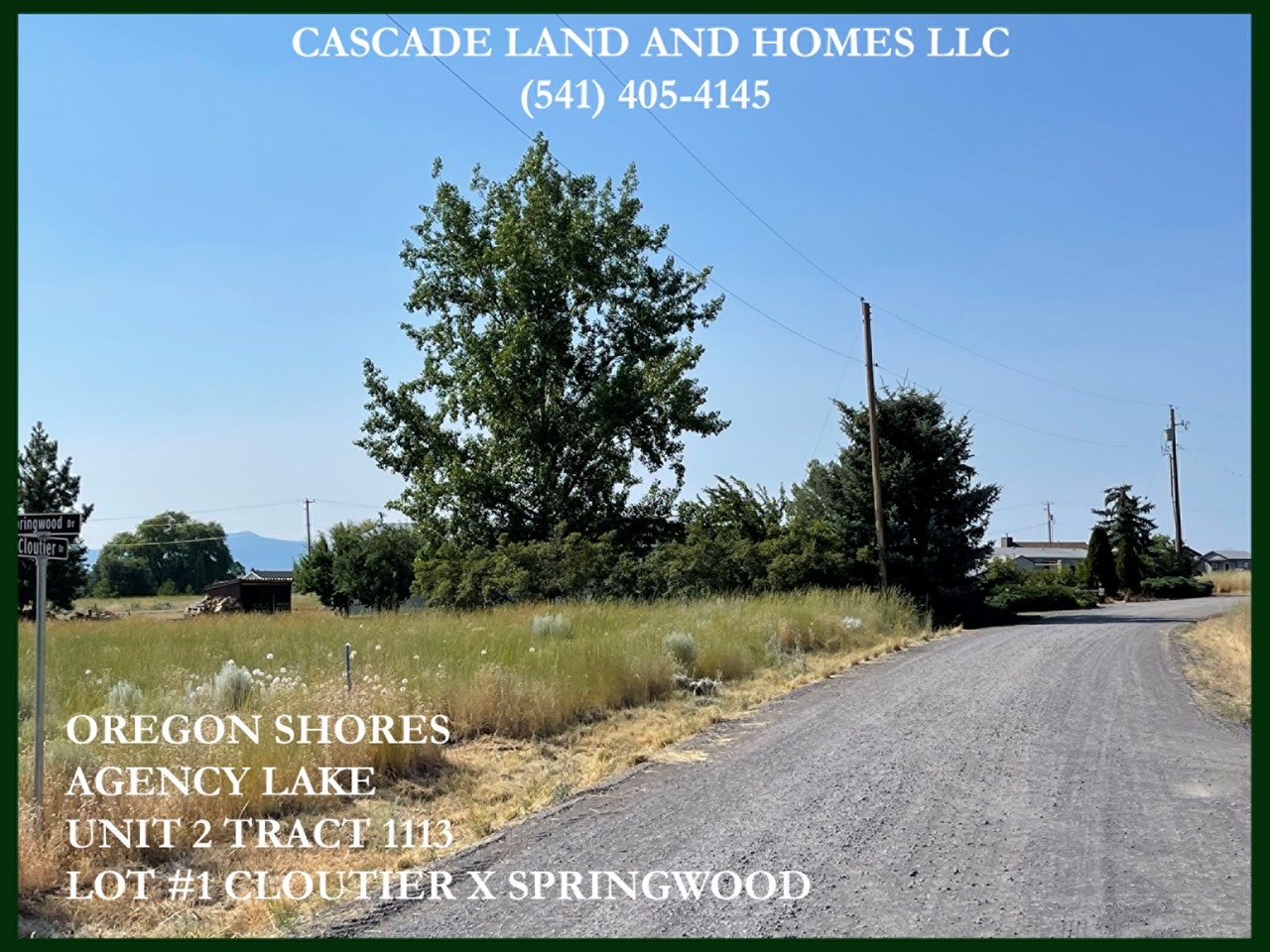 this photo is taken looking across the street from the property. the cascade mountains in the distance surround the valley and nearby agency lake.