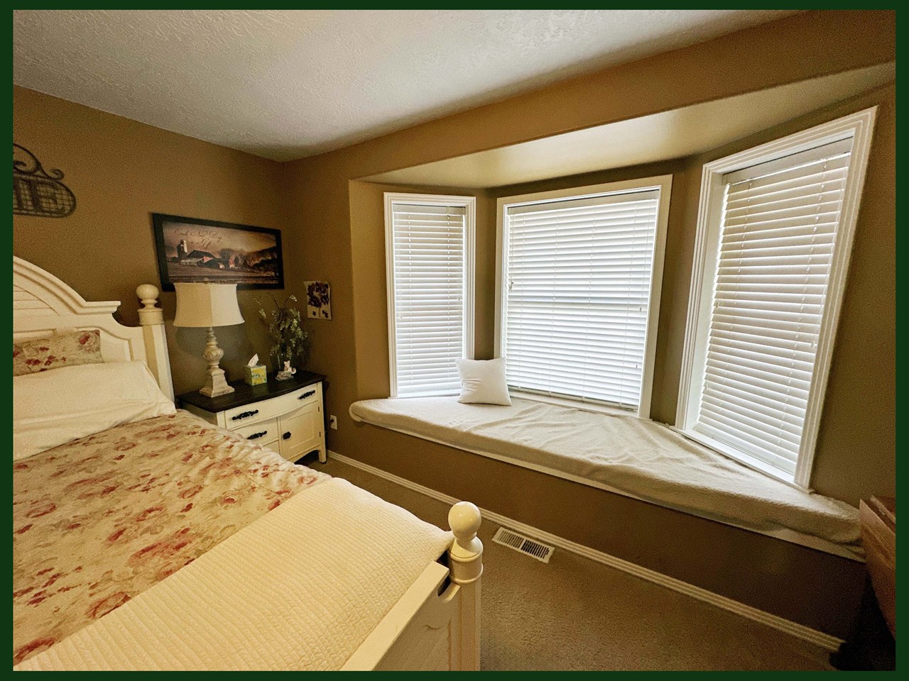 downstairs bedroom with large bay window