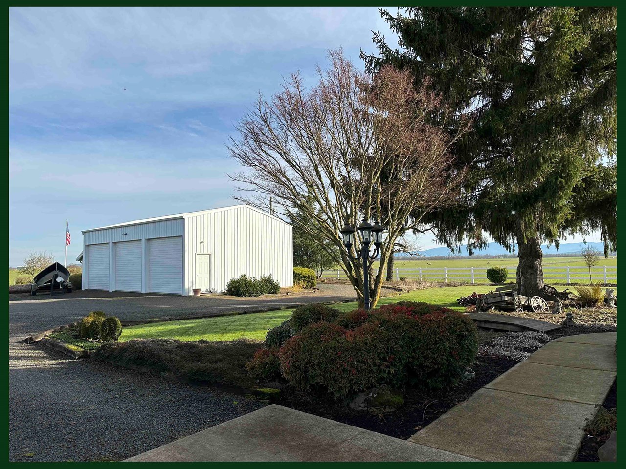 large metal 3-bay workshop/garage with concrete floors