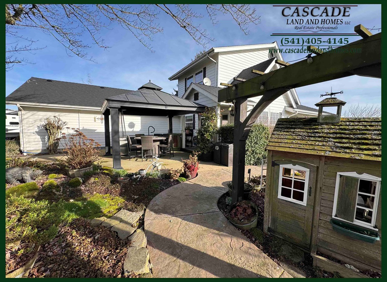 view from the back through the beautiful gardens to the gazebo